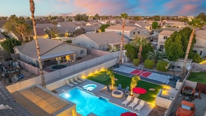 A residential area with a swimming pool, outdoor seating, and a basketball court. - The Cardinal Walk to Stadium Pool Spa Sportcourt (Glendale)