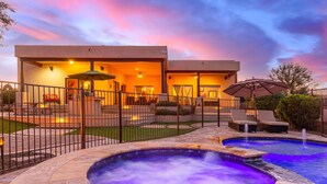 A modern outdoor pool area with a hot tub, lounge chairs, and a covered seating area. - Desert Foothils Rustic Resort Oasis w Pool Spa (Scottsdale)