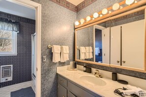 A bathroom with a large mirror, vanity, and a sink. There are towels hanging on the wall and a hairdryer on the counter. - 1 Country House Game Room BBQ Near Nashville TA (Franklin)