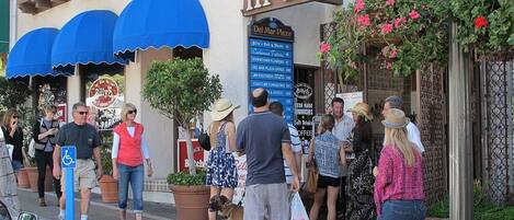 A street scene with a building labeled "III DEL MAR Plaza" and a sign for "Coastline Accounting Services".