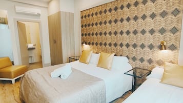 Habitación triple estándar, varias camas, vistas a la ciudad | Caja fuerte, cortinas opacas, sistema de insonorización y wifi gratis