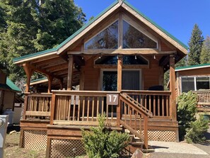 A wooden cabin with a balcony, a staircase, and a number '17' sign. - Cabin #17 at Hyatt Lake Resort (Jackson County)