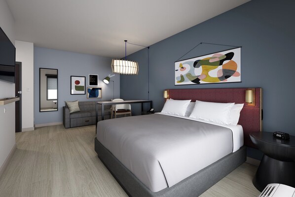 A modern hotel room with a large bed, a desk, and a chair. There is a painting on the wall and a clock on the bedside table. - Atwell Suites Belgrade Bozeman Airport by IHG (Belgrade)
