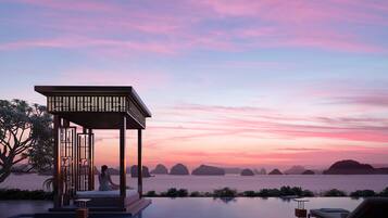 2 outdoor pools, open 7:00 AM to 6:00 PM, pool umbrellas