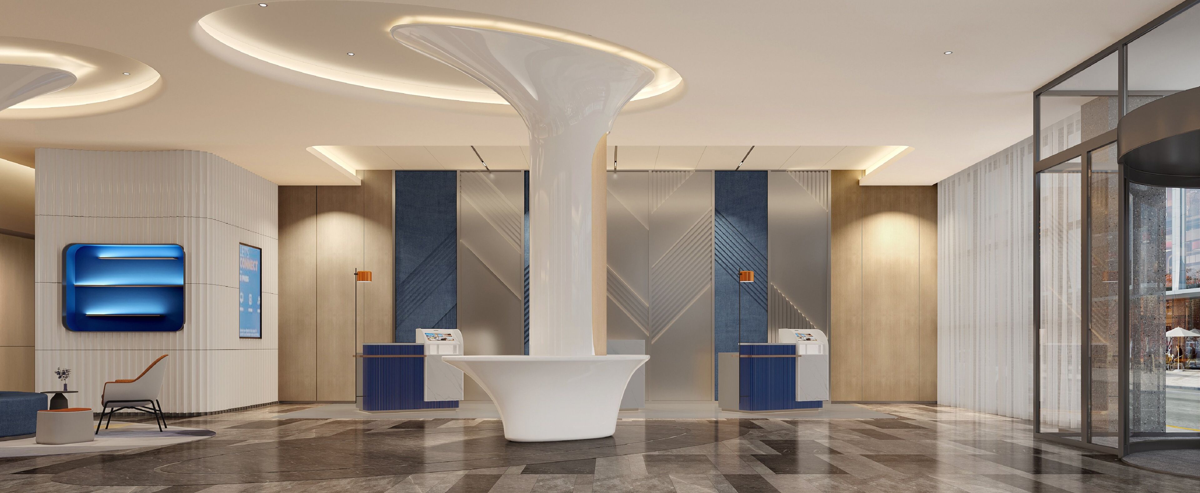 A modern lobby with a central white column, reception desks, and a patterned floor.