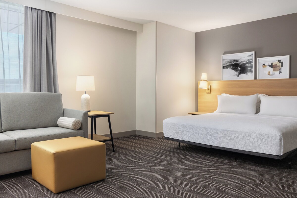 Premium bedding, pillow-top beds, desk, laptop workspace