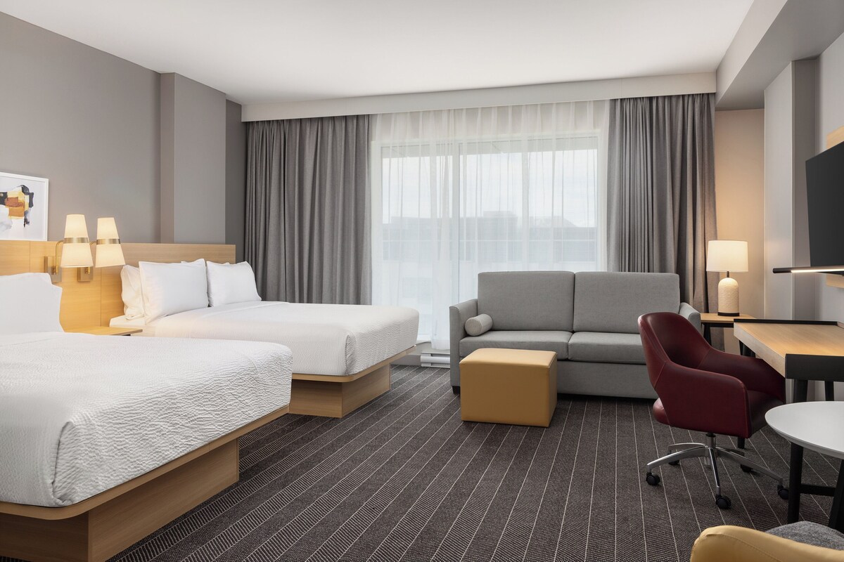 Premium bedding, pillow-top beds, desk, laptop workspace