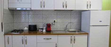 Microwave, stovetop, coffee/tea maker, electric kettle