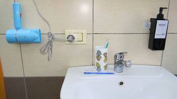 Hair dryer, towels, soap, shampoo