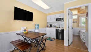 Fridge, microwave, coffee/tea maker, cookware/dishes/utensils