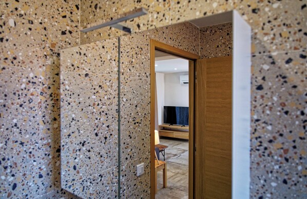 Shower, rainfall showerhead, hair dryer, toilet paper