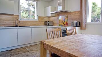 Espresso maker, electric kettle, freezer, dining tables