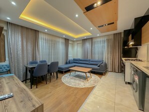Elite Duplex, 3 Bedrooms, Terrace | Living area | 53-inch TV with satellite channels - Flower City Suites (Cinarcik)