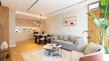 Apartamento exclusivo | Área de estar | Smart TV 140 cm com canais a cabo
