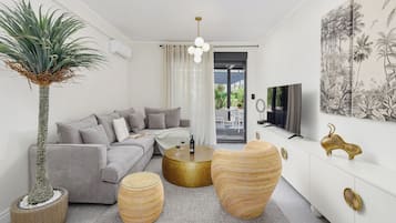 ONE BEDROOM APARTMENT | Living area | 140-cm Smart TV with cable channels