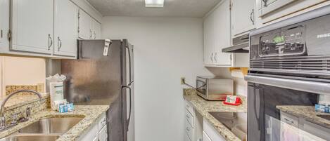 Fridge, microwave, stovetop, coffee/tea maker