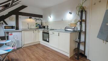 Fridge, microwave, toaster, cookware/dishes/utensils