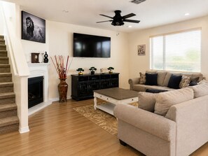 Smart TV, fireplace, foosball, books