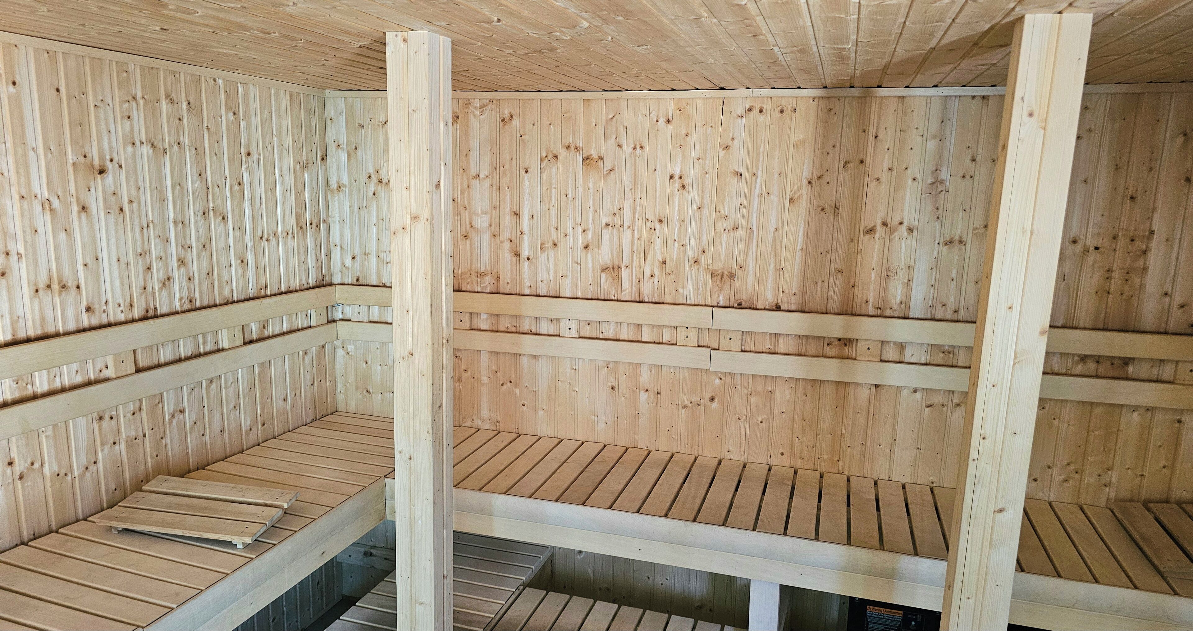 A sauna with wooden walls and benches.