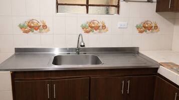 Fridge, stovetop, cookware/dishes/utensils, dining tables