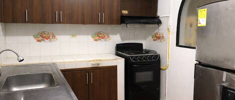 Fridge, stovetop, cookware/dishes/utensils, dining tables