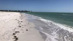 A beach with clear skies and calm waters.