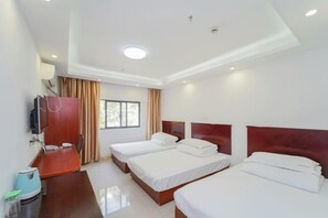 A hotel room with two beds, a desk with a chair, a television, and a window with curtains. - Lingshan Hotel (Shanghai)