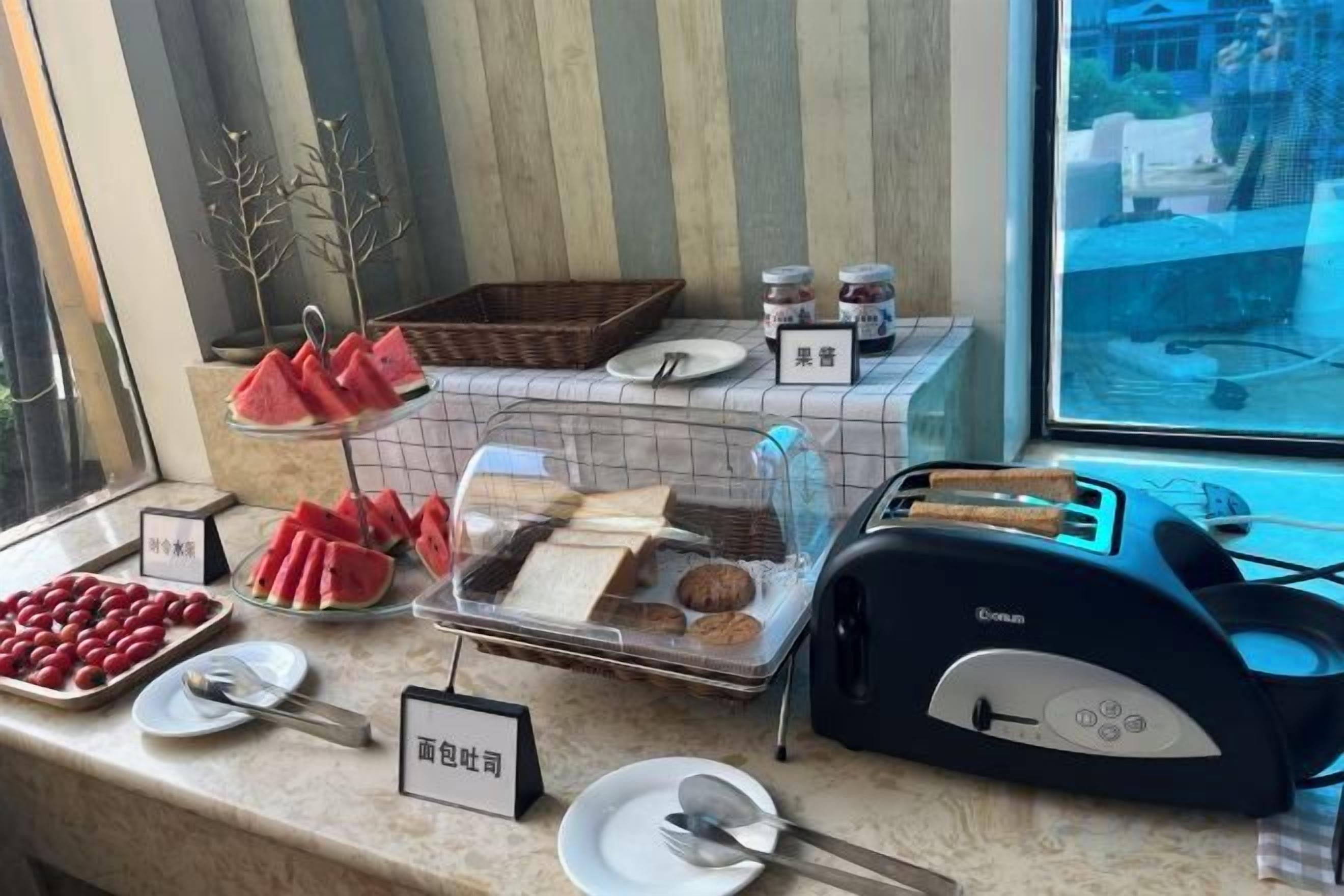 A breakfast buffet with various food items and a toaster.