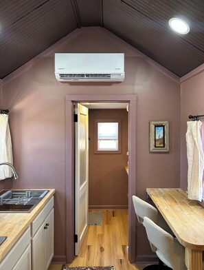 Fridge, microwave, coffee/tea maker, cookware/dishes/utensils