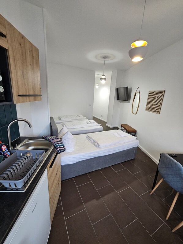 Estudio, 3 camas individuales, cocina | Escritorio, espacio para trabajar con laptop y wifi gratis