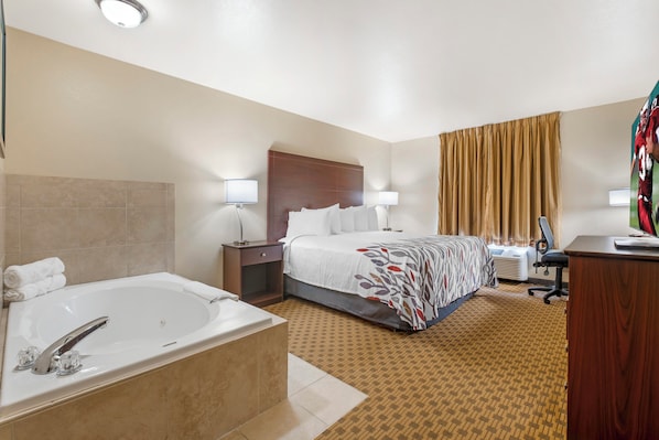 Superior Room, 1 King Bed, Non Smoking, Jetted Tub | Desk, laptop workspace, blackout curtains, iron/ironing board