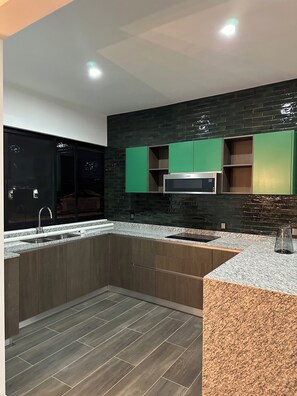 Fridge, microwave, stovetop, coffee/tea maker