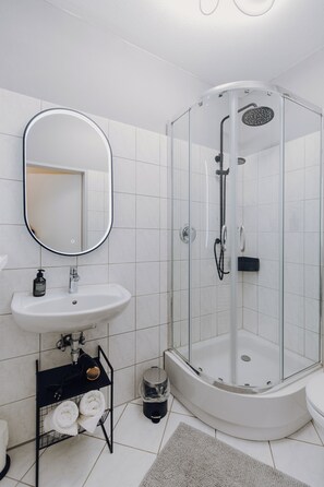 Shower, hair dryer, towels, soap
