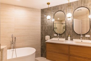 Shower, hair dryer, towels, toilet paper