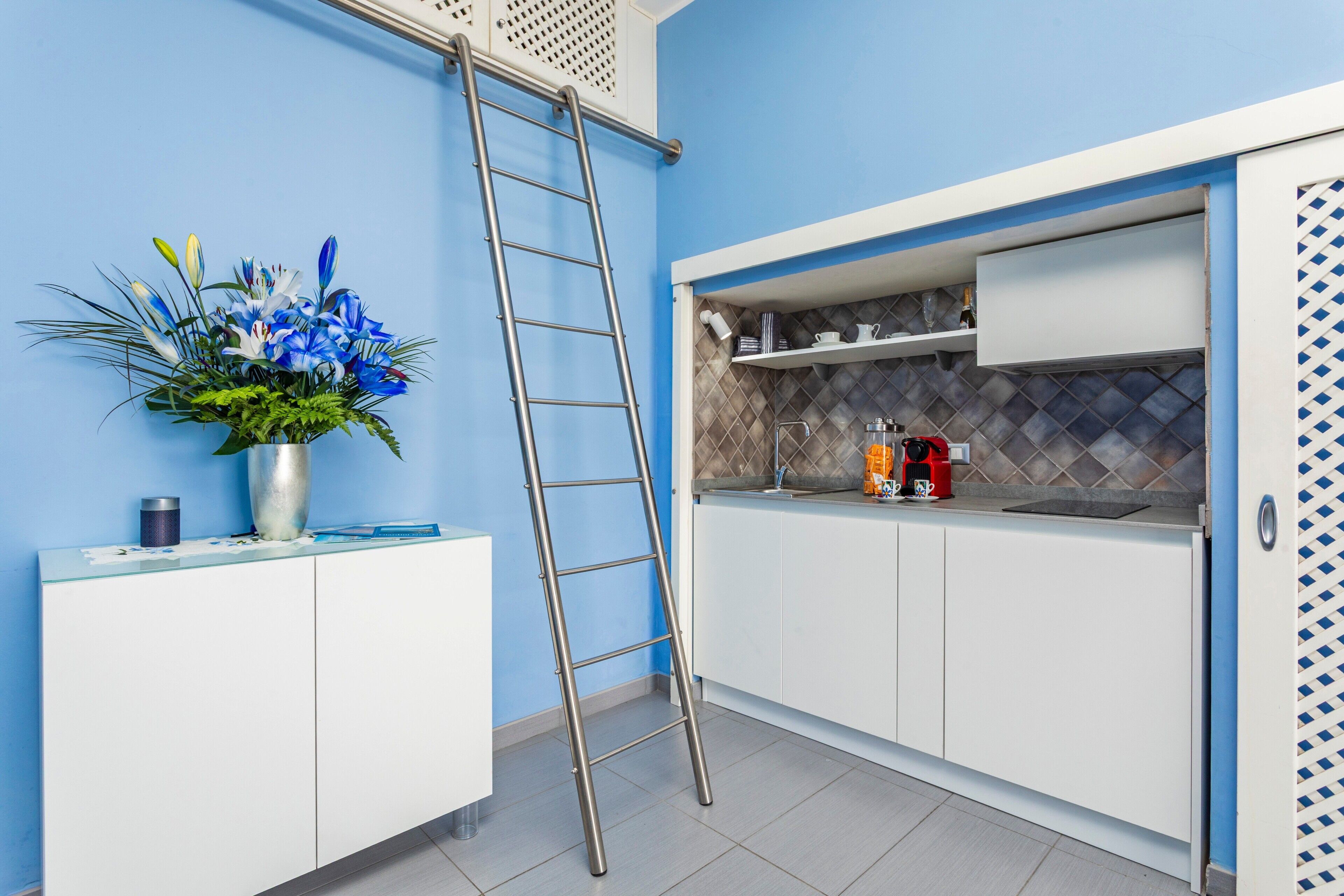 Fridge, stovetop, dishwasher, coffee/tea maker