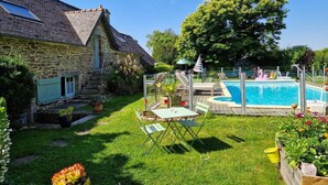 A stone house with a swimming pool, a grassy yard, and a large tree. - Guest Room 'Magnolia' with Shared Pool, Shared Terrace, and Wi-Fi (Arzano)