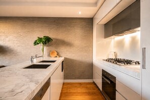 Coffee/tea maker, fridge, microwave, oven