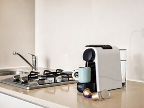 Coffee/tea maker, fridge, microwave, stovetop