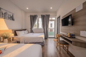 Executive Twin kamer | Een minibar met enkele gratis items, een bureau, gratis wifi, beddengoed
