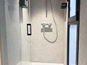 Shower, hair dryer, towels, soap
