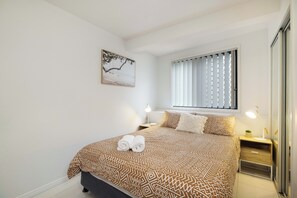 2 bedrooms, desk, laptop workspace, iron/ironing board