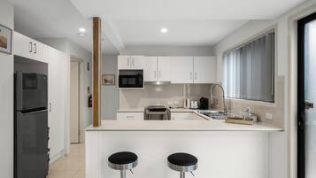 Fridge, microwave, stovetop, cookware/dishes/utensils