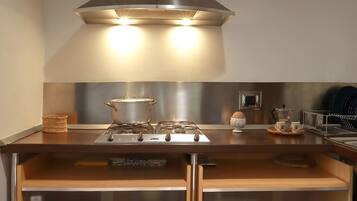 Fridge, oven, coffee/tea maker, cookware/dishes/utensils