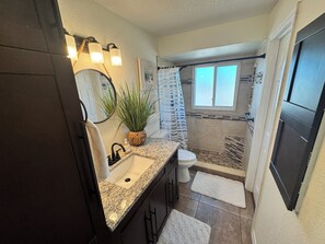 Shower, hair dryer, towels, soap