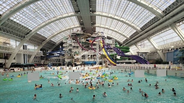 An indoor water park with multiple slides and pools. - Charming 2-bedroom basement in superb Edmonton with WiFi near WEM (Edmonton)