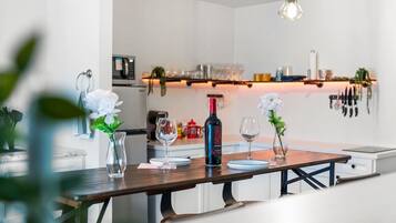Fridge, microwave, coffee/tea maker, cookware/dishes/utensils