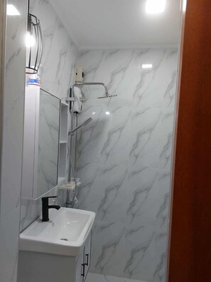 Shower, towels, soap, shampoo