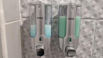 Shower, rainfall showerhead, bidet, towels