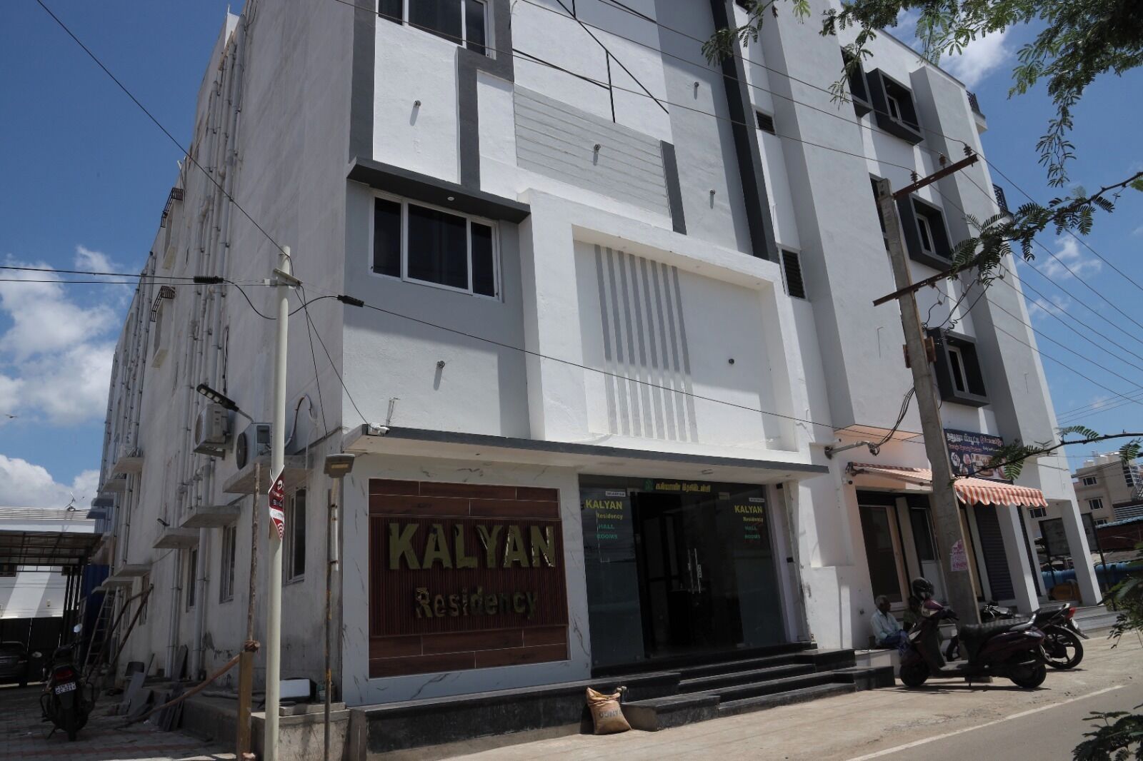 A multi-story building with a sign reading "KALYAN Residency".