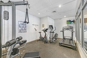 Stay fit on your vacation with a fully equipped gym featuring a weight machine, elliptical trainer, stationary bike, and treadmill.